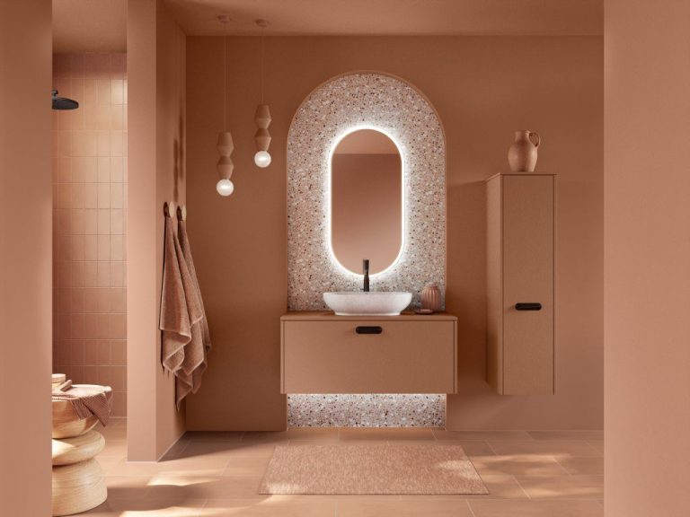 Terracotta vanity with arched illuminated mirror