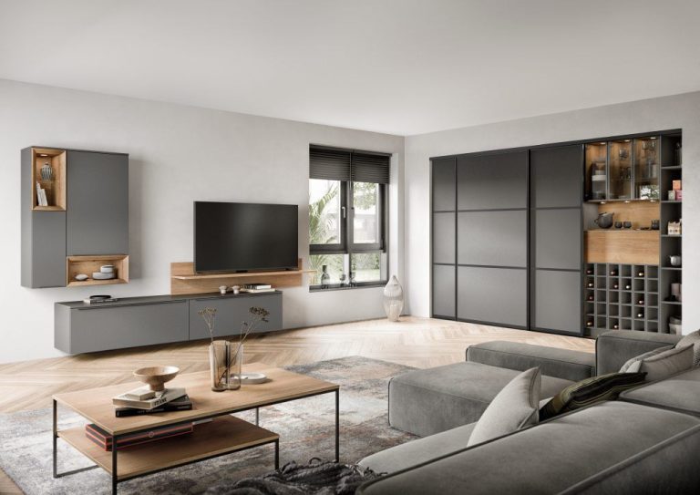 Slate grey TV wall with sliding door storage